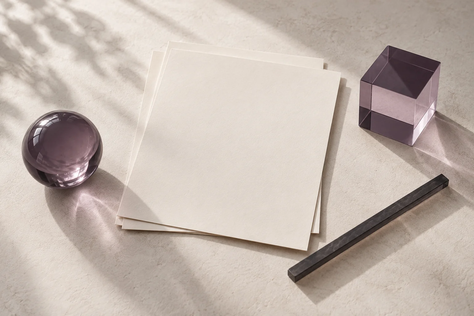 Blank paper and translucent shapes arranged as a quiet study of uncertainty